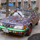 Image for article titled Groovalicious Purple Princess Of Peace Art Car Falls On Hard Times, Faces Crusher